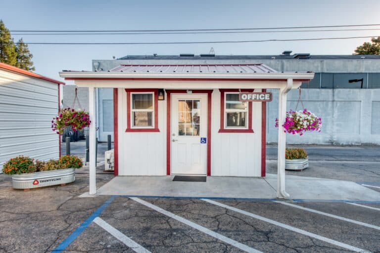 white and red trimmed custom shed in California