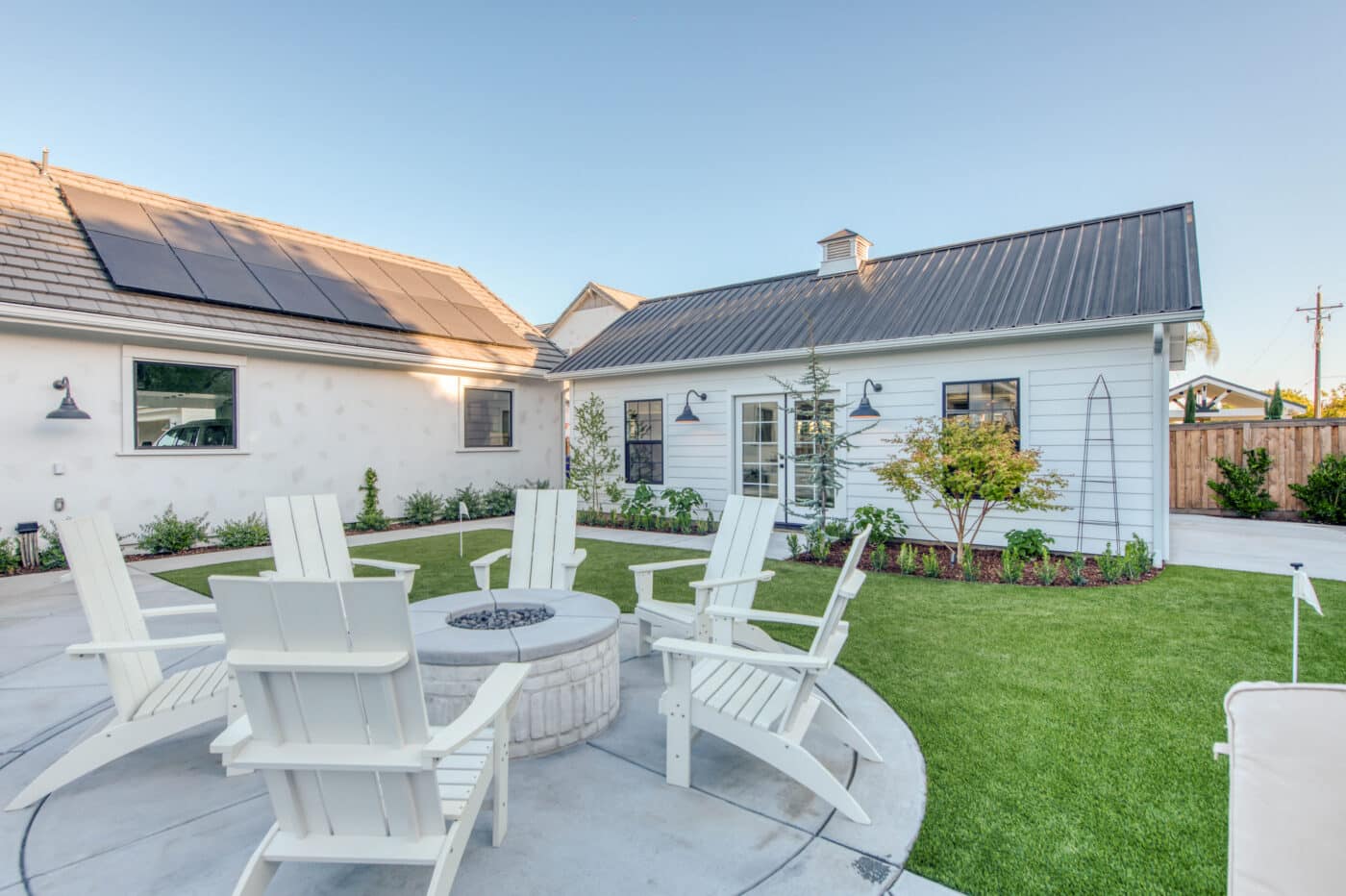 white cabana near chairs and fire pit